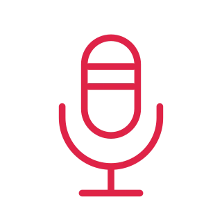 An upright capsule microphone sits in a curved stand with a flat foot.