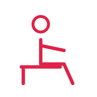 A simple faceless line figure is shown seated, with a circular head and clearly separated limbs.