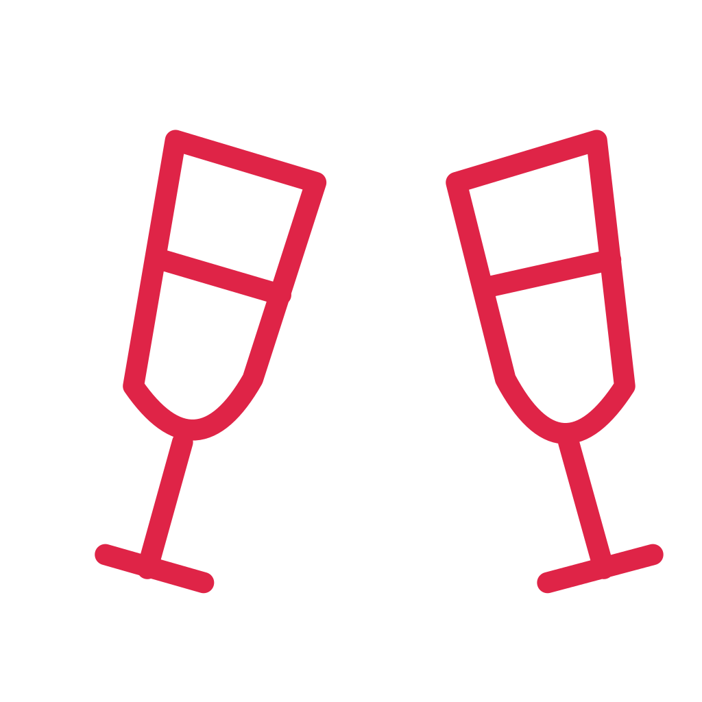 Two tilted stemmed glasses angle towards each other for a celebratory toast.
