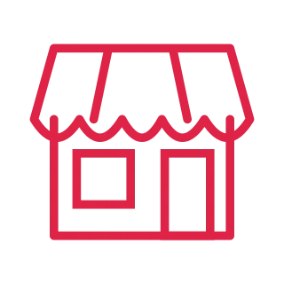 A small shopfront has a scalloped awning, window and entrance door.