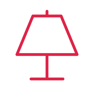 A trapezoid lamp shade stands on a slender stem and flat base.