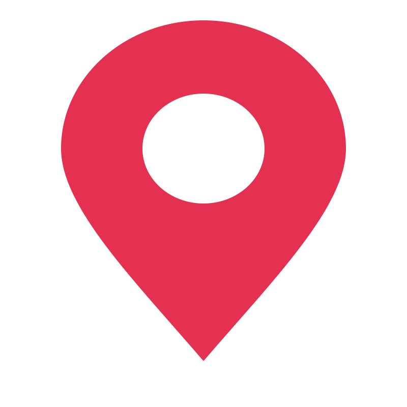 A red location marker with a circular opening in its centre.