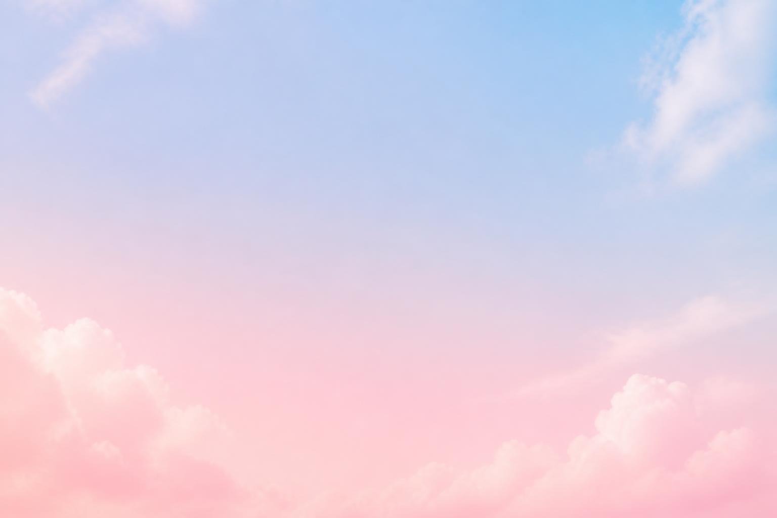 pastel pink and blue sky with fluffy clouds