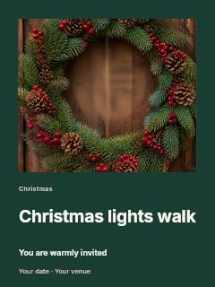 Festive Christmas wreath with pine cones and berries in Christmas lights walk · Gallery editorial