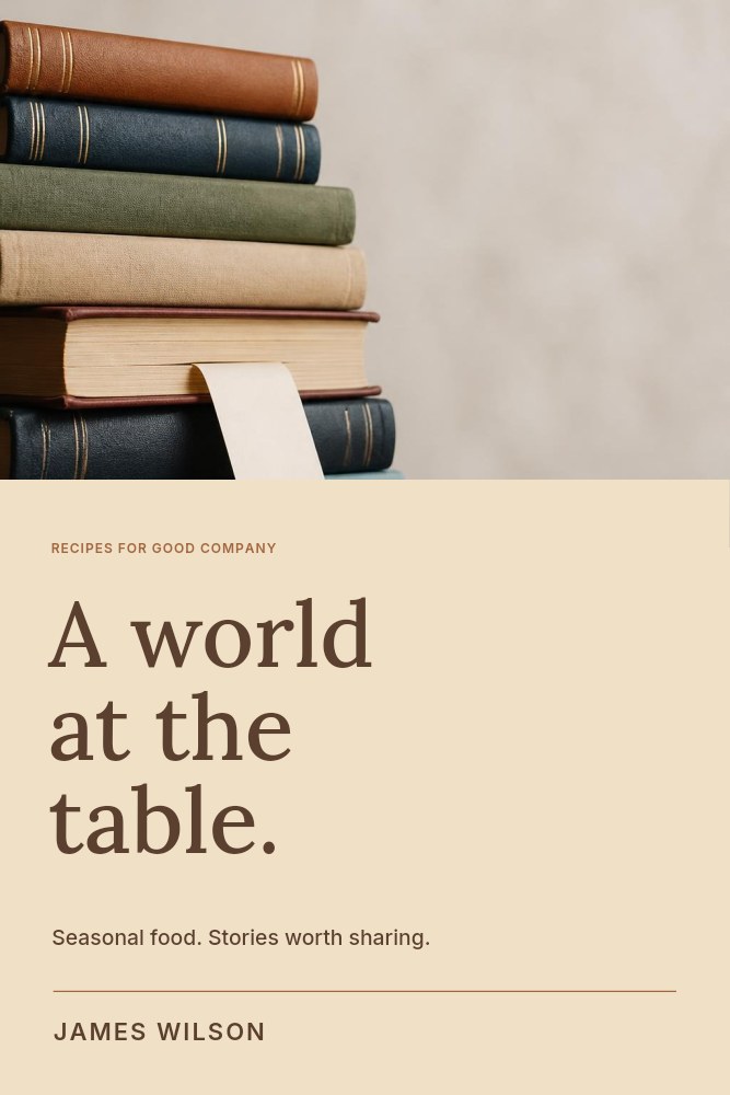 stack of hardcover books with bookmark in A world at the table · Cookbook cover