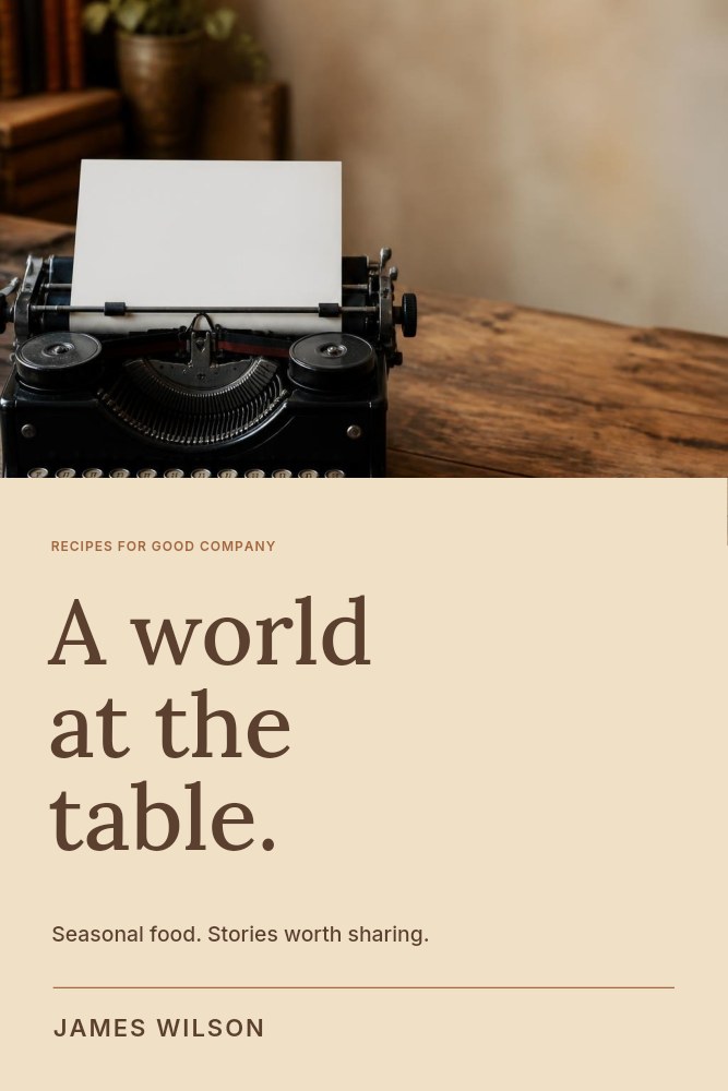 Vintage black typewriter on wooden table in A world at the table · Cookbook cover